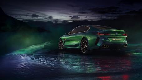 Sleek Green BMW Under Dramatic Skies wallpaper