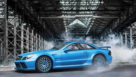 Vibrant Blue Sports Car in an Urban Setting wallpaper