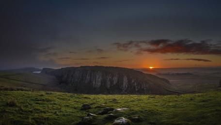 Serene Sunset Over Majestic Cliffs wallpaper