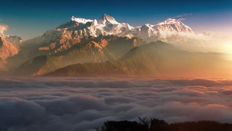Majestic Peaks Above the Clouds wallpaper