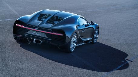 Sleek Black Hypercar on the Track wallpaper