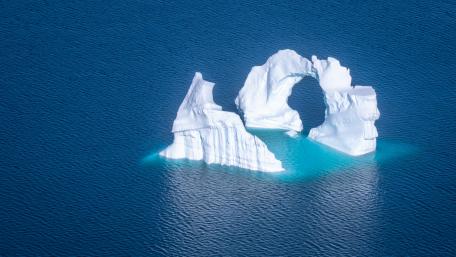 Majestic Iceberg Surrounded by Tranquil Waters wallpaper