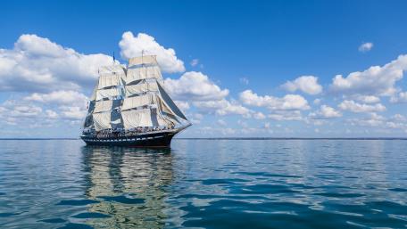 Majestic Sailing Ship on Calm Waters wallpaper