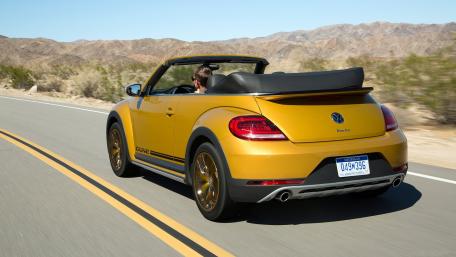 Vibrant Yellow Convertible on a Scenic Drive wallpaper