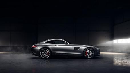 Sleek Grey Sports Car in Dimly Lit Garage wallpaper
