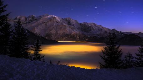 Majestic Mountain Glow at Night wallpaper