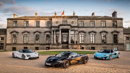 Luxury Supercars in a Grand Setting wallpaper