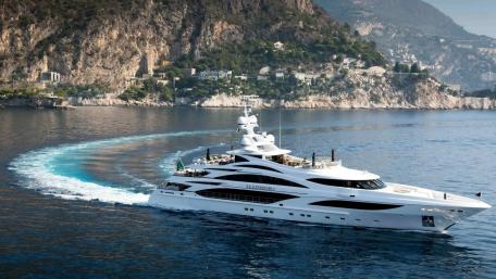 Luxury Yacht Sailing Through Serene Waters of the Coastline wallpaper