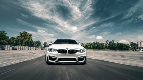 Sleek Performance of a BMW Car on the Open Road wallpaper