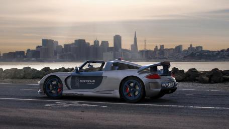 Sleek Porsche on Coastal City Drive wallpaper