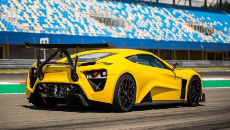 Vibrant Yellow Sports Car on the Track wallpaper