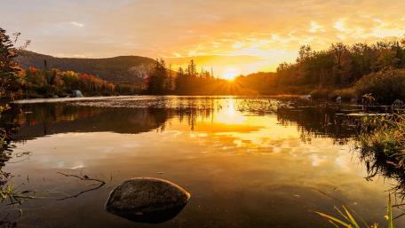 Golden Autumn Sunset Over Tranquil Lake wallpaper