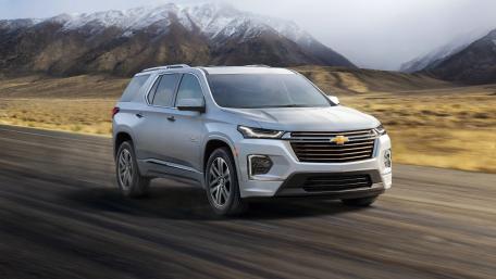 Sleek Chevy SUV in Motion Against Stunning Mountainscape wallpaper