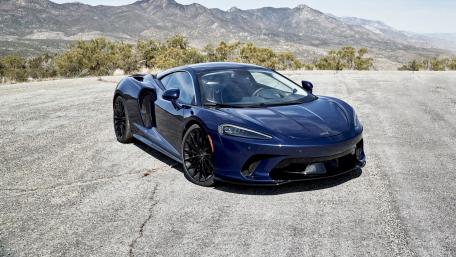 Sleek McLaren GT Against a Breathtaking Landscape wallpaper