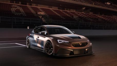 Sleek Racing Car on Track at Dusk wallpaper