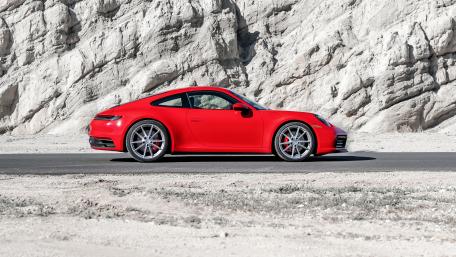 Stunning Red Sports Car Against a Desert Landscape wallpaper