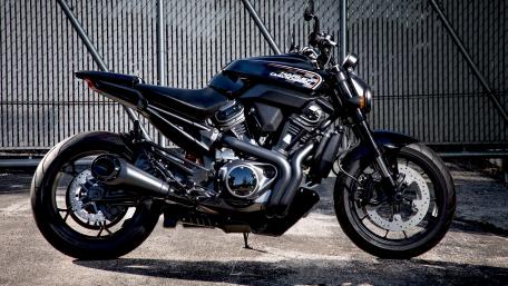 Sleek Black Motorcycle Wallpaper for Tech Lovers wallpaper