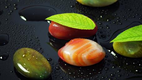 Vibrant Nature Inspired Stones with Leaves wallpaper
