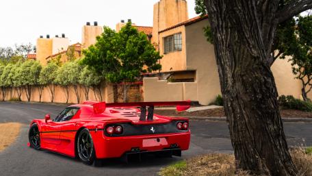 Sleek Ferrari on a Serene Roadway wallpaper