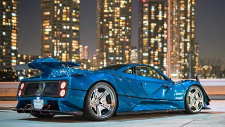 Stunning Blue Supercar in City Lights wallpaper