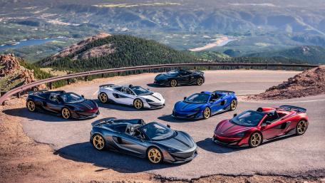 Stunning Display of Supercars in Scenic Landscape wallpaper