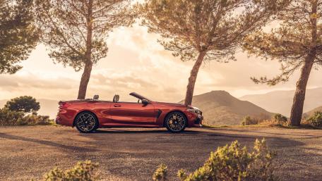 Sleek Convertible Against Scenic Backdrop wallpaper