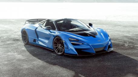 Sleek Blue McLaren Supercar Wallpaper wallpaper