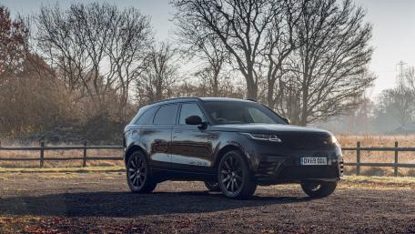 Sleek Black Luxury SUV on a Misty Morning wallpaper