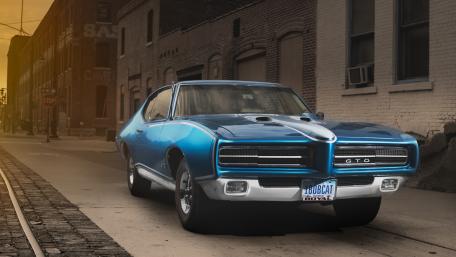 Classic Blue Muscle Car GTO on Urban Street wallpaper