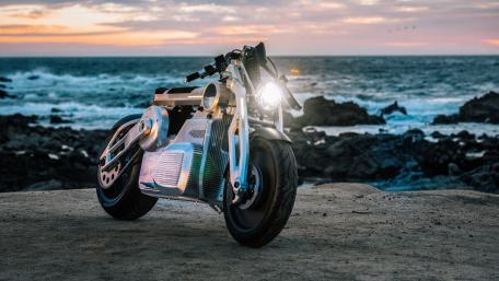 Sleek Motorcycle by the Shoreline at Sunset wallpaper
