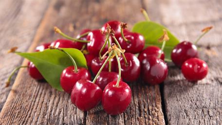 Juicy Cherries on Rustic Wood Table wallpaper