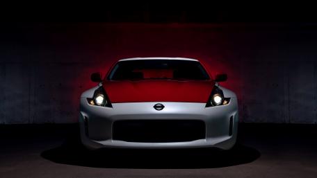 Sleek Red and White Sports Car Wallpaper wallpaper