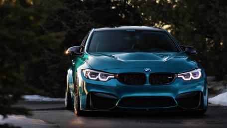 Sleek BMW M4 in Stunning Teal Shade wallpaper