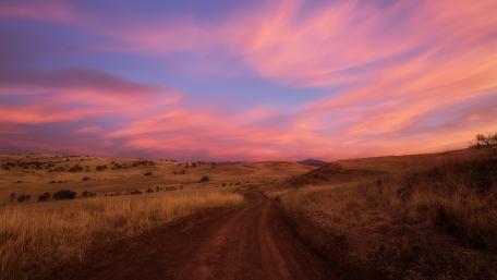 Serene Sunset Over Rolling Hills wallpaper