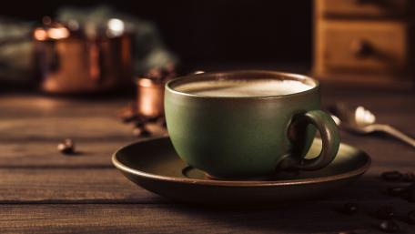 Warm Cup of Coffee on a Wooden Table wallpaper