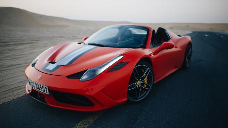 Sleek Ferrari in a Desert Landscape wallpaper