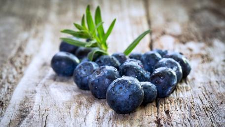 Fresh Blueberries on Rustic Wood Surface wallpaper