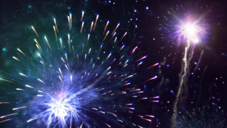 Explosive Night Sky Filled with Colorful Fireworks wallpaper