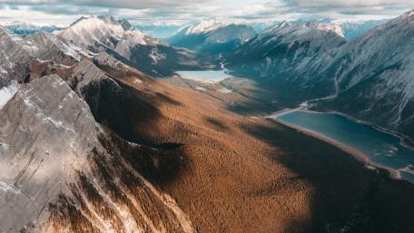 Majestic Mountain Range Under a Golden Glow wallpaper