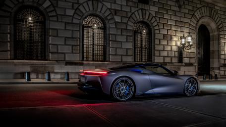 Sleek Luxury Car at Nighttime Glow wallpaper