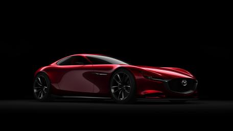 Sleek Red Sports Car on Black Background wallpaper