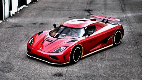 Sleek and Powerful Red Sports Car Wallpaper wallpaper