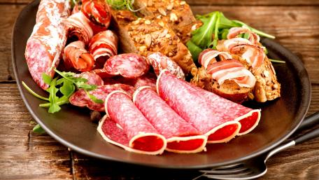 Savory Charcuterie Platter Delightful Assortment of Meats wallpaper