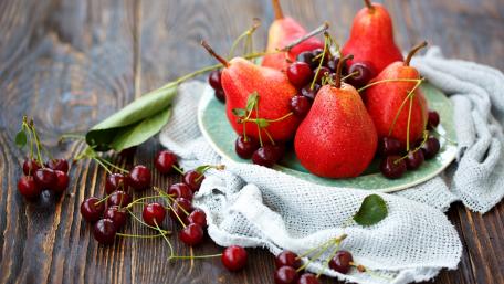 Vibrant Pears and Cherries Displaying Freshness and Flavor wallpaper