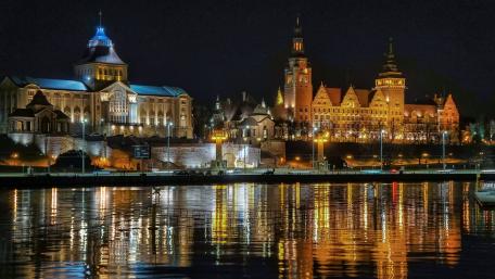 Enchanting Nightscape of a Cityscape by the Water wallpaper