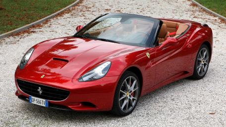 Sleek Ferrari Convertible on a Scenic Driveway wallpaper