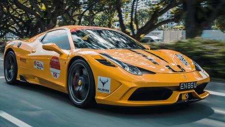 Vibrant Orange Ferrari on the Road wallpaper