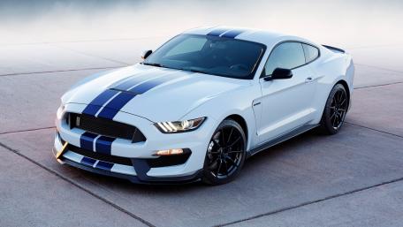 Sleek White Mustang with Blue Stripes wallpaper