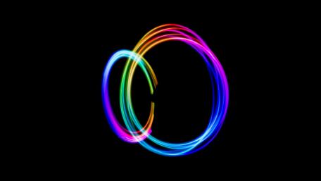 Vibrant Light Swirls in Darkness wallpaper