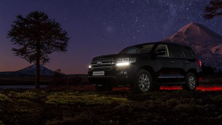 Stunning Night View of a Luxurious SUV in Nature wallpaper